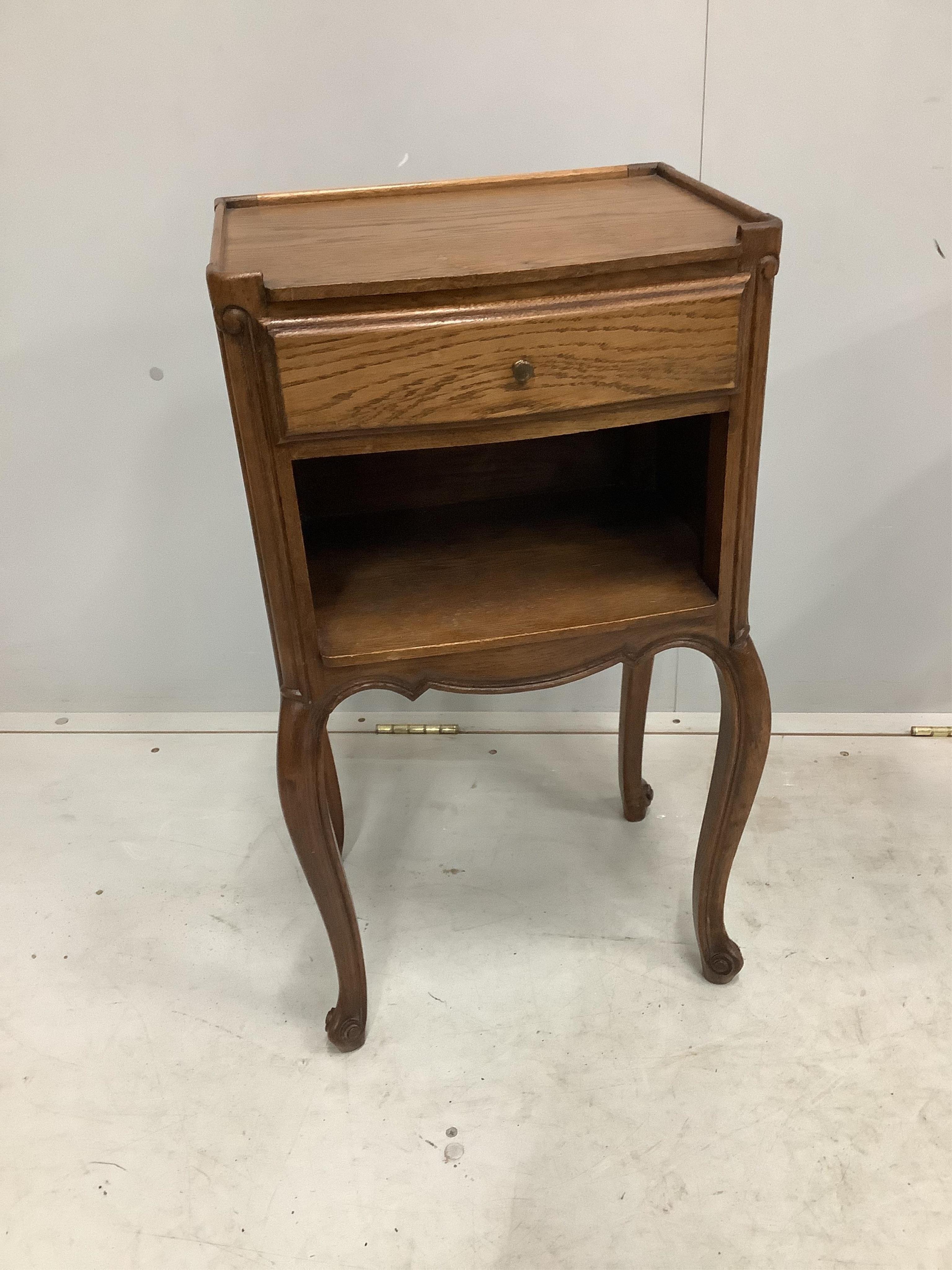 A pair of French oak bedside cabinets, width 38cm, depth 28cm, height 70cm. Condition - fair to good